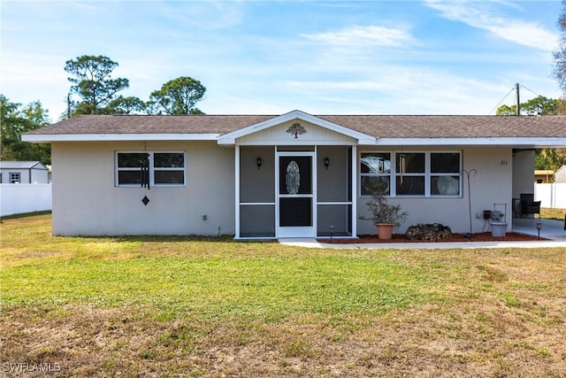 single story home with a front yard