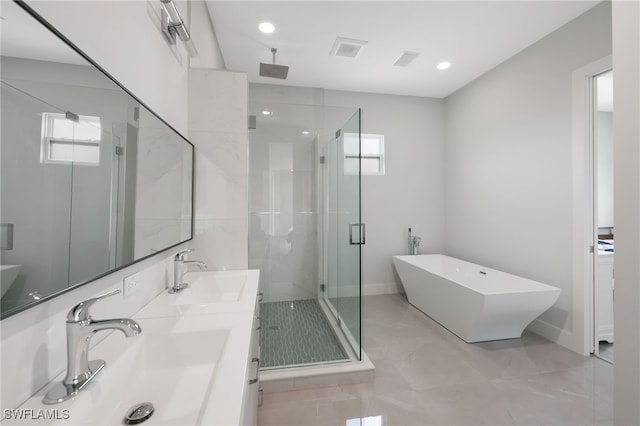 bathroom featuring plus walk in shower and vanity