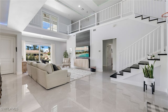 living room with a towering ceiling