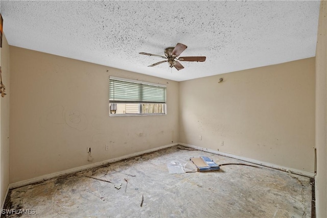 spare room featuring ceiling fan and a textured ceiling