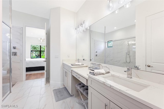 bathroom with vanity and a shower with shower door