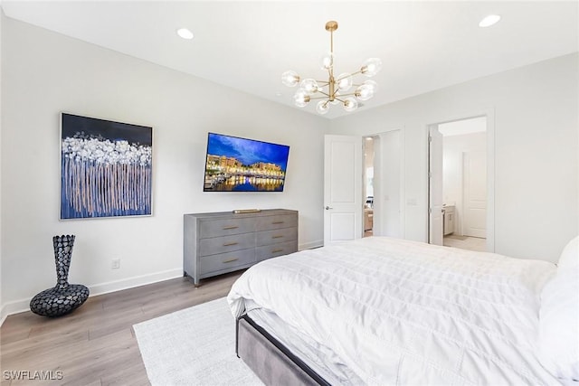 bedroom featuring a notable chandelier and light wood-type flooring