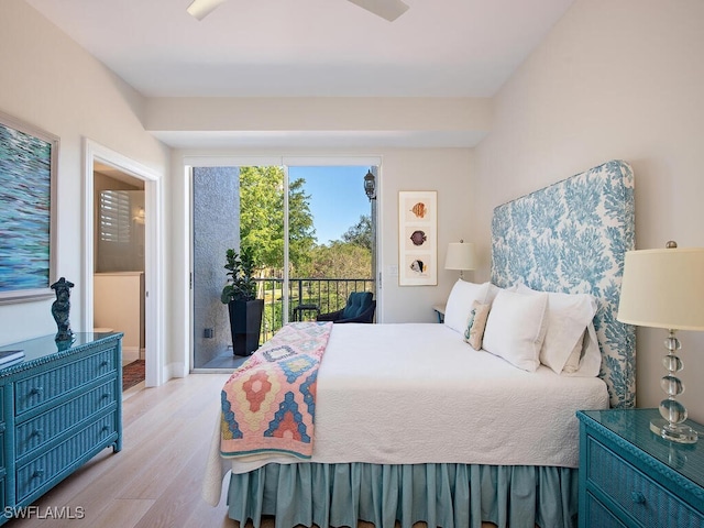 bedroom with access to exterior and light hardwood / wood-style floors