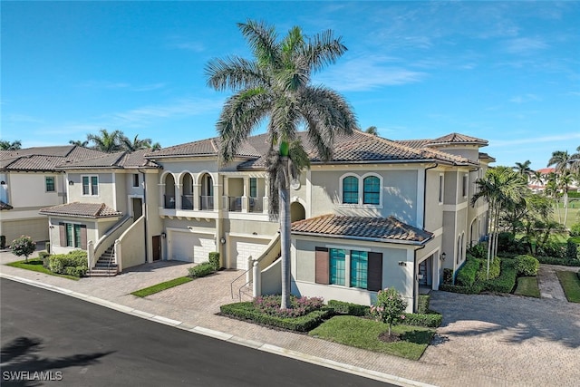 mediterranean / spanish house with a garage