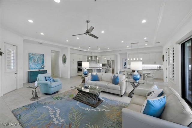 living room with crown molding and ceiling fan