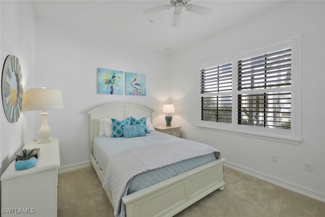 bedroom with light carpet and ceiling fan