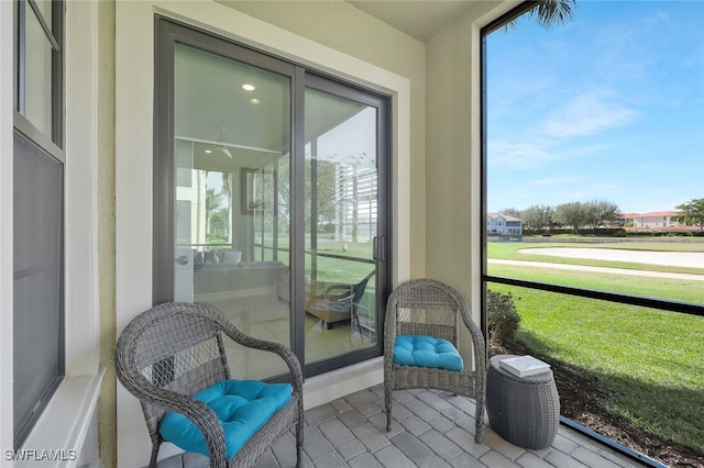 sunroom / solarium featuring a wealth of natural light