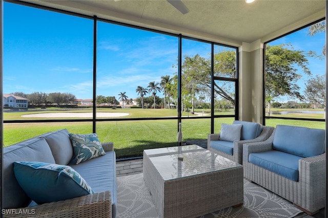 sunroom / solarium with ceiling fan