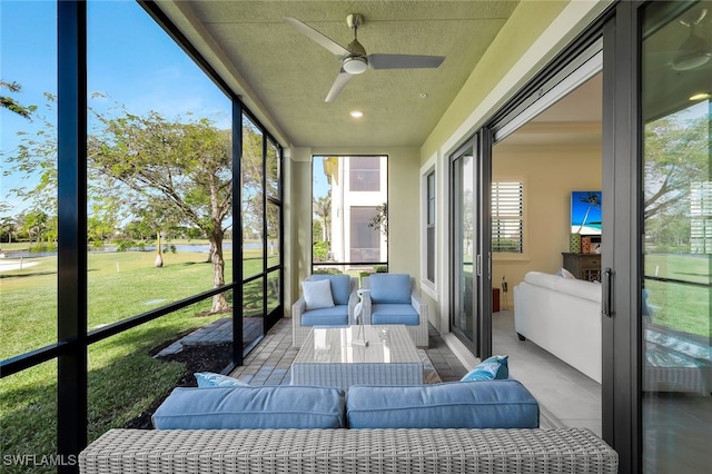 sunroom / solarium with ceiling fan