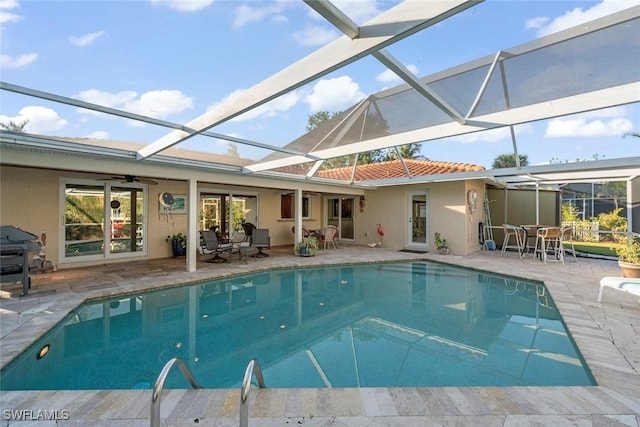 view of pool featuring a patio, a lanai, a grill, and ceiling fan