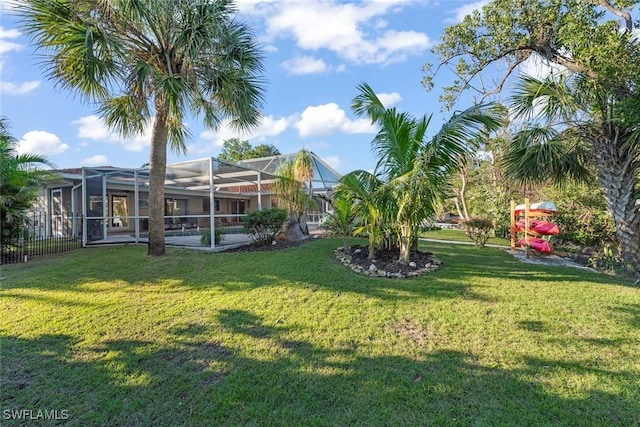 view of yard featuring a lanai