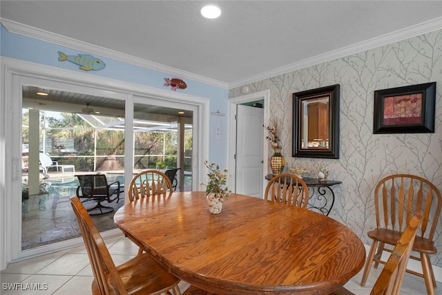 dining room featuring light tile patterned floors and ornamental molding