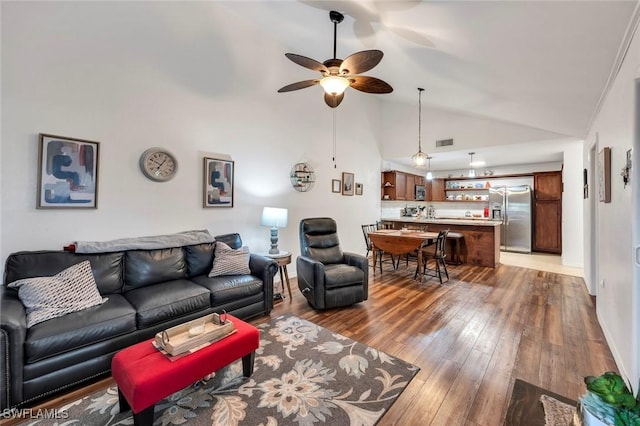 living room with high vaulted ceiling, dark hardwood / wood-style floors, and ceiling fan