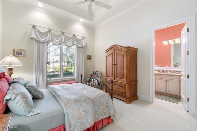 carpeted bedroom with sink, ornamental molding, ceiling fan, and ensuite bathroom