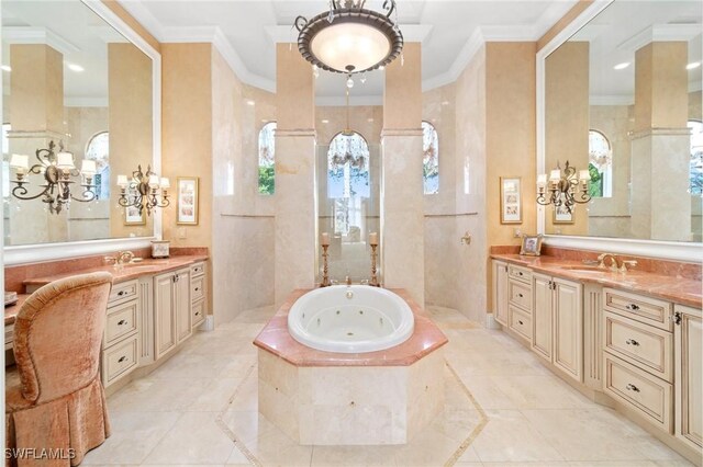 bathroom featuring vanity, tiled tub, and ornamental molding