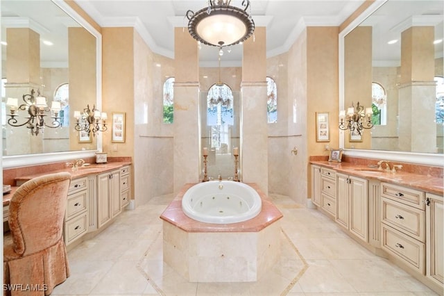 bathroom featuring ornamental molding, a jetted tub, two vanities, and a sink