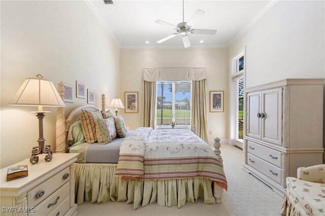 carpeted bedroom featuring crown molding and ceiling fan