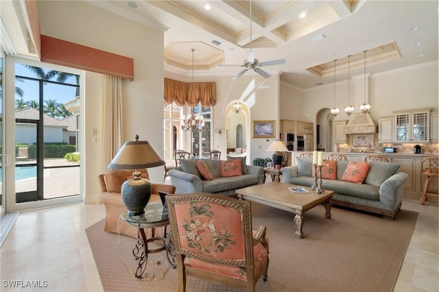 living room with crown molding, beamed ceiling, coffered ceiling, and a high ceiling