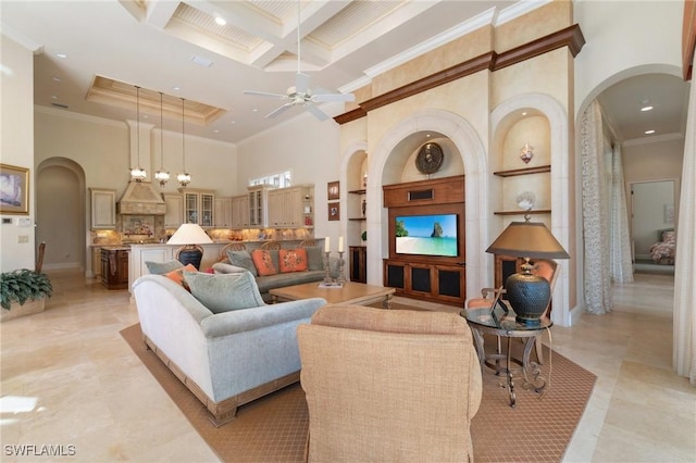 living area featuring ornamental molding, beamed ceiling, coffered ceiling, and a high ceiling