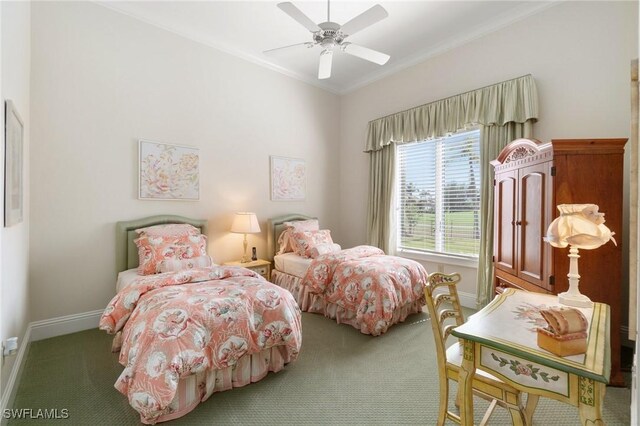 carpeted bedroom featuring ornamental molding and ceiling fan