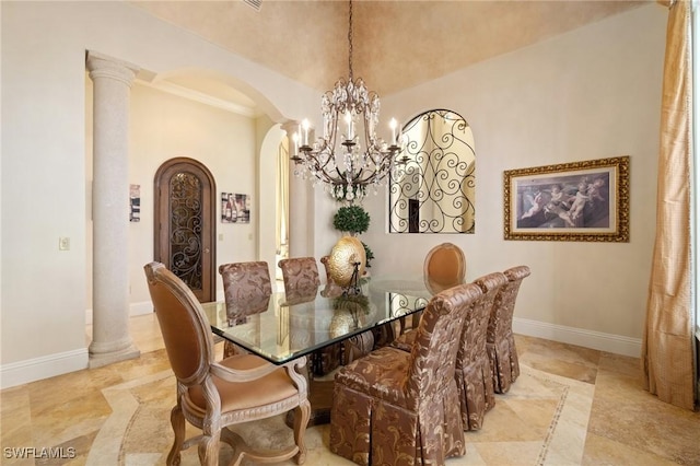 dining room with decorative columns, vaulted ceiling, and a chandelier