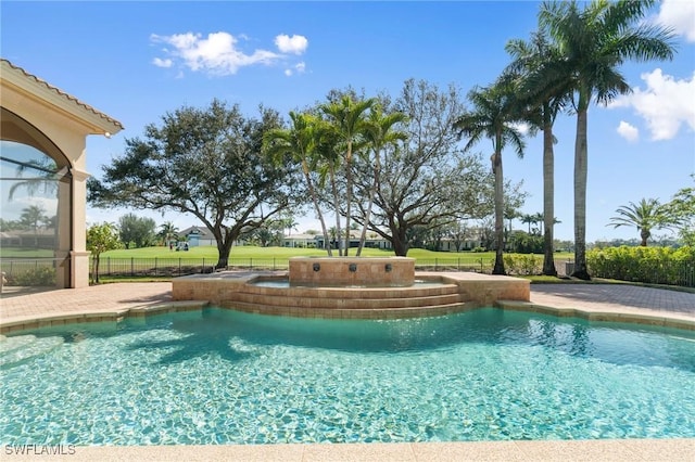 view of pool featuring fence