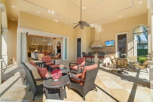 view of patio / terrace featuring ceiling fan and an outdoor living space