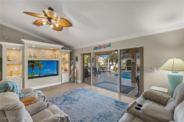 living room with ceiling fan, lofted ceiling, ornamental molding, and light tile patterned floors