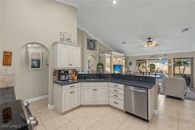 kitchen featuring appliances with stainless steel finishes, white cabinetry, sink, ornamental molding, and kitchen peninsula