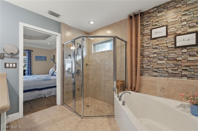 bathroom with crown molding, separate shower and tub, and tile patterned flooring