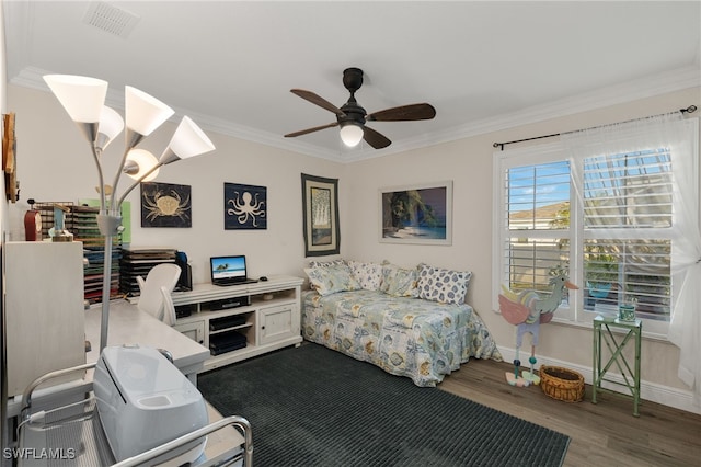 bedroom featuring ornamental molding, wood-type flooring, and ceiling fan