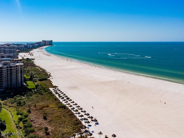 bird's eye view featuring a beach view and a water view