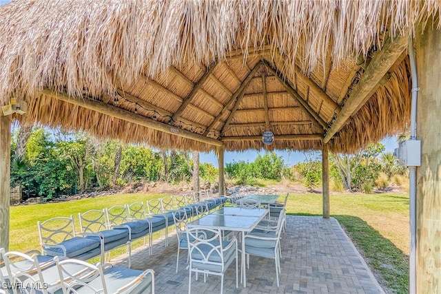 view of patio featuring a gazebo and outdoor dining area