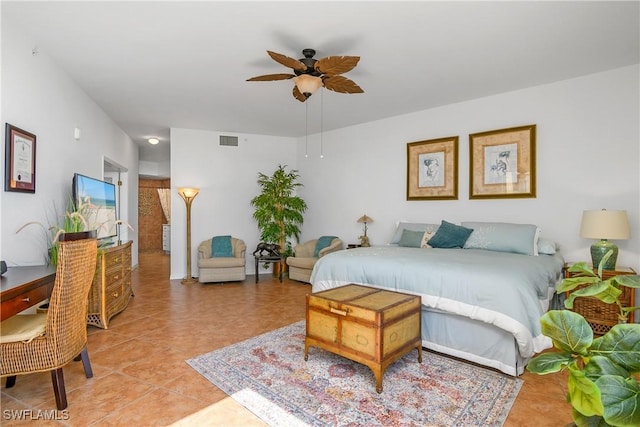 tiled bedroom with ceiling fan