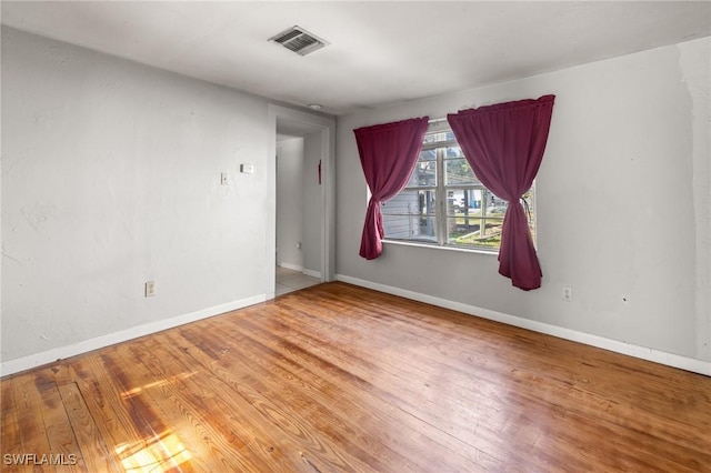 empty room featuring hardwood / wood-style flooring