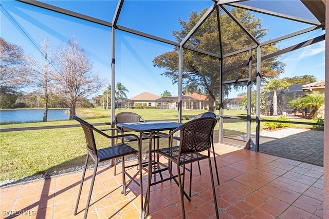 unfurnished sunroom with a water view