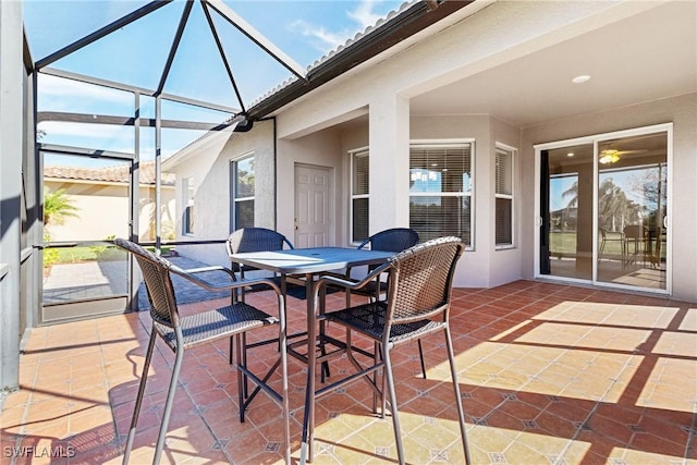 view of patio / terrace with a lanai