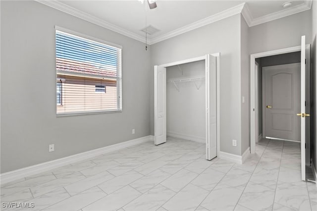 unfurnished bedroom with ceiling fan, ornamental molding, and a closet