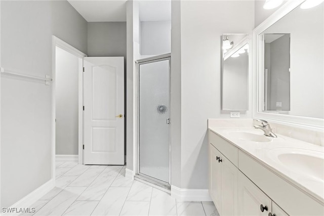 bathroom with walk in shower and vanity