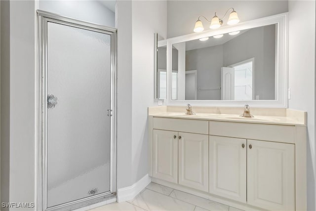 bathroom featuring vanity and a shower with shower door