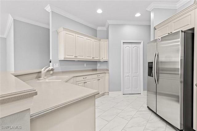 kitchen featuring stainless steel refrigerator with ice dispenser, ornamental molding, kitchen peninsula, and sink