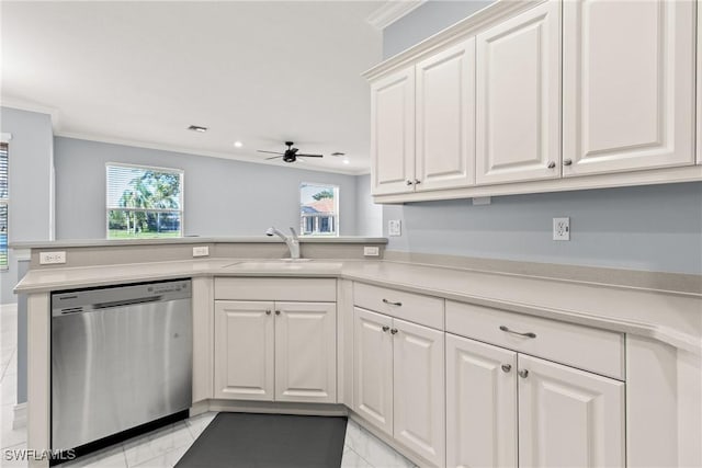 kitchen featuring dishwasher, sink, white cabinets, and kitchen peninsula