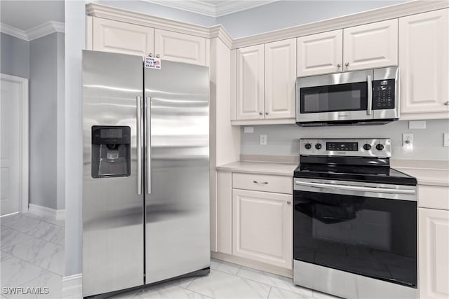 kitchen with white cabinetry, ornamental molding, and appliances with stainless steel finishes