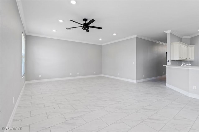 spare room with ceiling fan and ornamental molding