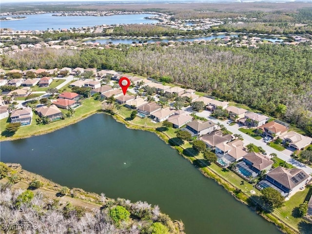 birds eye view of property featuring a water view