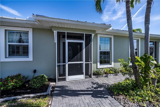 doorway to property with a patio area