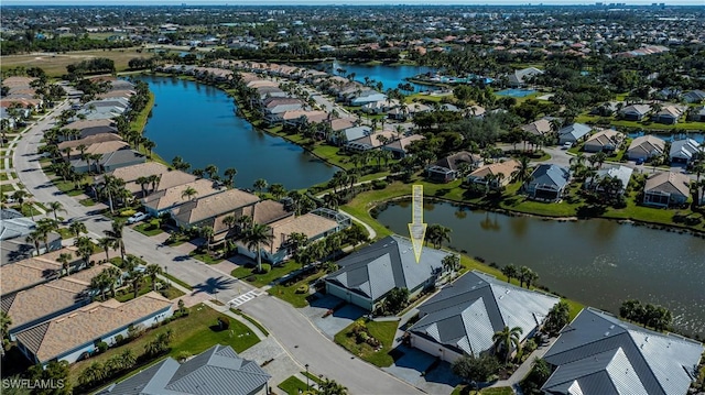 drone / aerial view with a water view