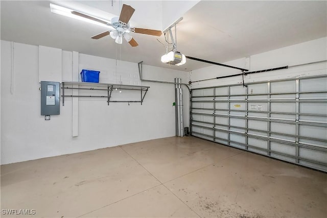 garage with a garage door opener and electric panel