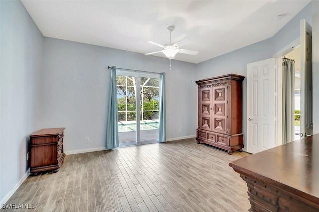 interior space with ceiling fan and light hardwood / wood-style floors