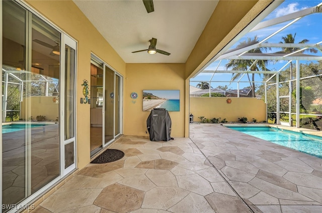 view of pool with a lanai and a patio